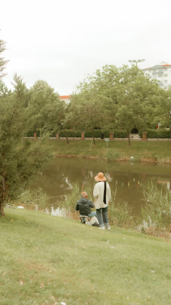 A couple enjoying a peaceful fishing day by the Porsuk River in Eskişehir, Türkiye.